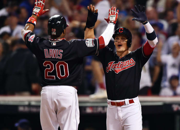 Nov 2, 2016; Cleveland, OH, USA; Cleveland Indians center fielder Rajai Davis (20) is congratulated by teammate Brandon Guyer (6) after hitting a two-run home run against the Chicago Cubs in the 8th inning in game seven of the 2016 World Series at Progressive Field. Mandatory Credit: Ken Blaze-USA TODAY Sports
